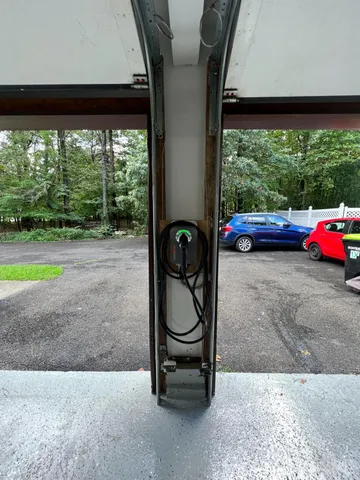 a room with pool table and chairs