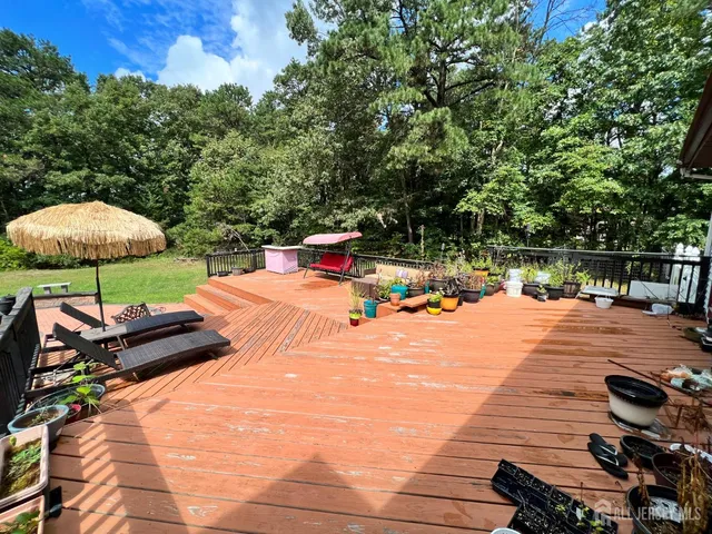 swimming pool view with a seating space