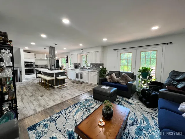 a living room with furniture and a rug