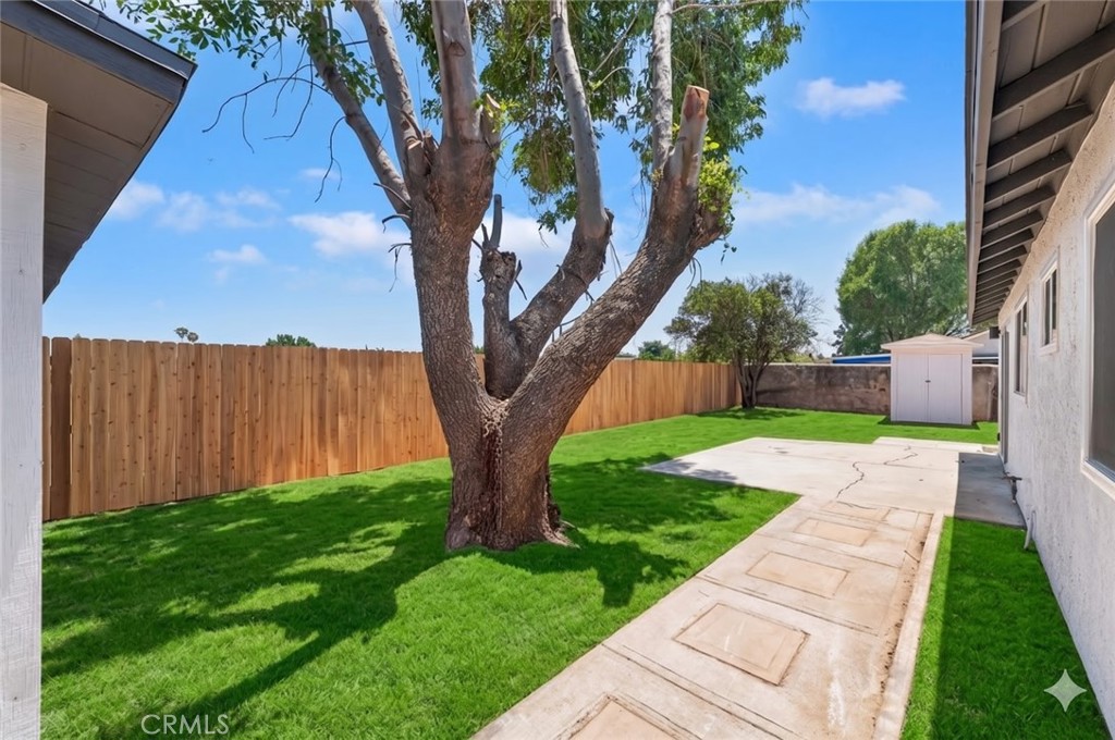 6940 Keating Drive Riverside, CA 92503 - Photo 13 of 15 a view of a yard with plants and a large tree
