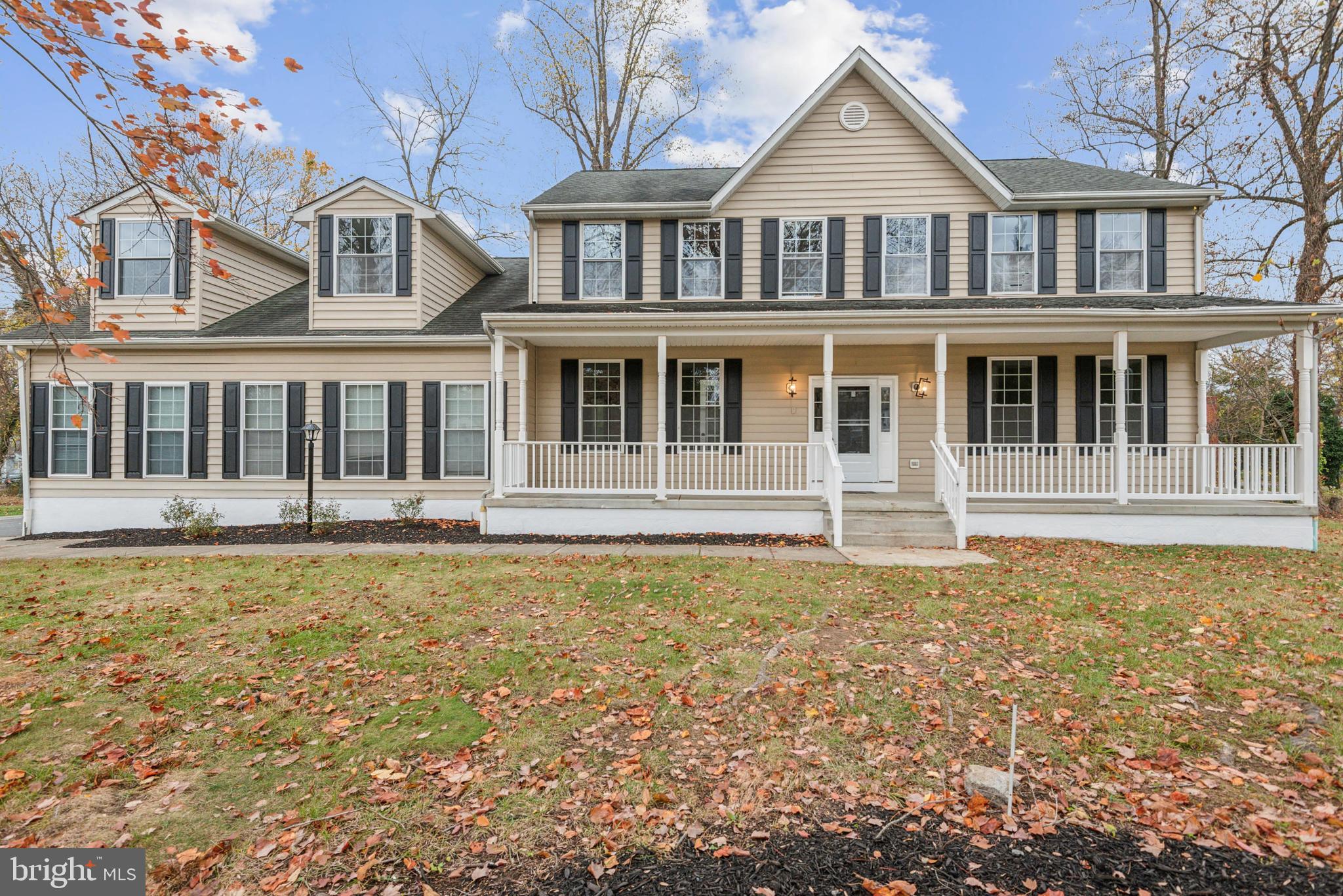 1825 Johnson Road Annapolis, MD 21409 - Photo 1 of 44 a front view of a house with a garden