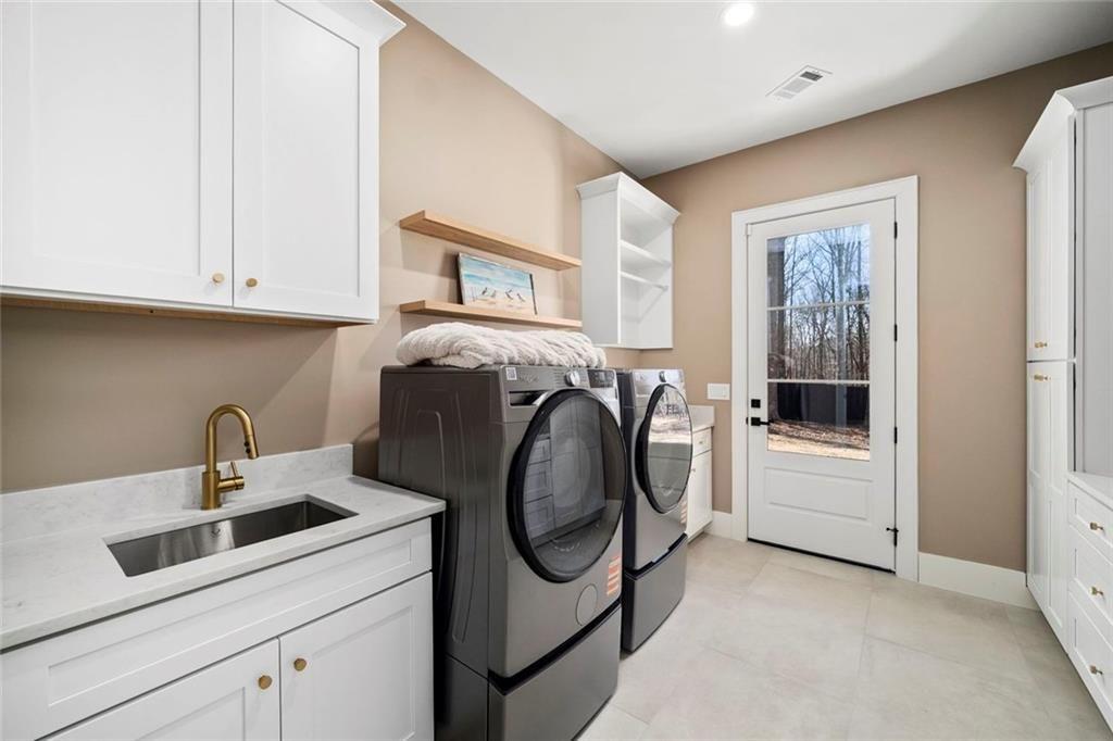 2309 Dinsmore Road Milton, GA 30004 - Photo 37 of 87 a utility room with dryer and washer