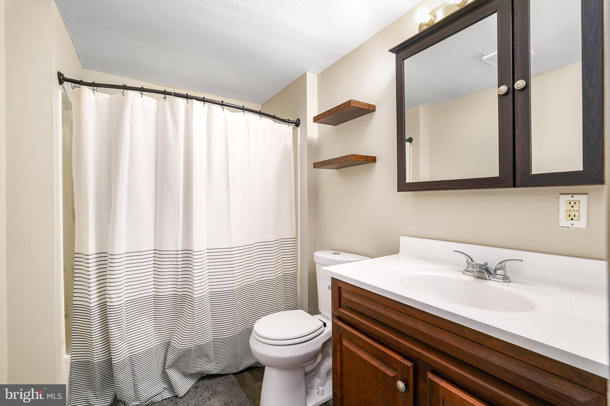3050 Singerly Road Elkton, MD 21921 - Photo 12 of 24 a bathroom with a sink and a mirror