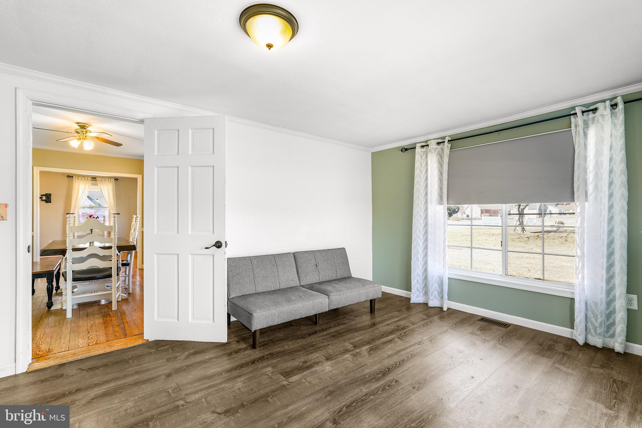 3050 Singerly Road Elkton, MD 21921 - Photo 14 of 24 a view of an empty room with wooden floor and a window