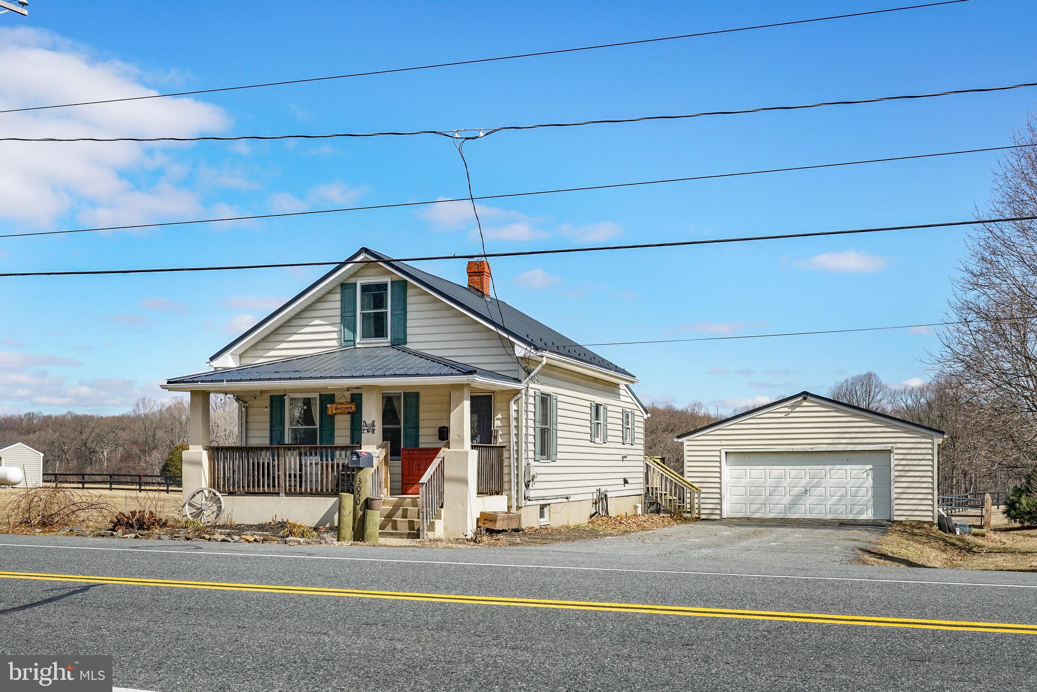 3050 Singerly Road Elkton, MD 21921 - Photo 2 of 24 a front view of a house with a yard
