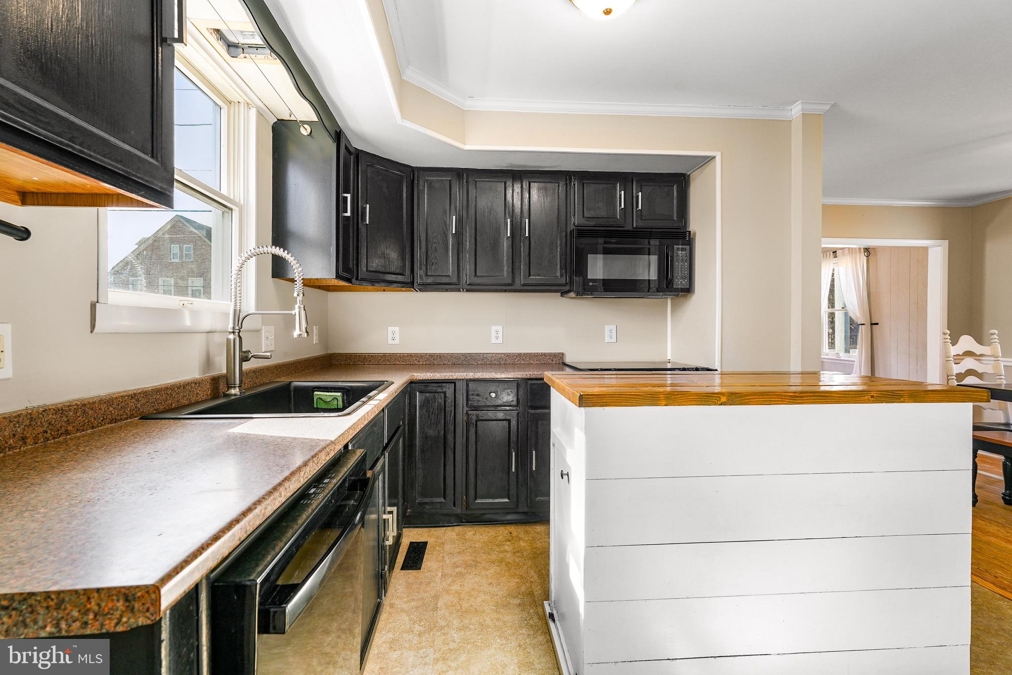 3050 Singerly Road Elkton, MD 21921 - Photo 6 of 24 a kitchen with a stove and a sink