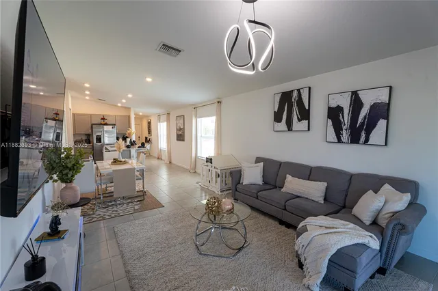 a bedroom with a bed and a ceiling fan