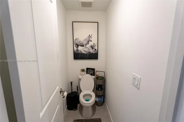 a bathroom with a double vanity sink mirror and shower