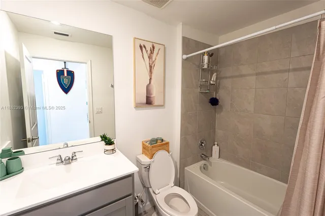 a view of a workspace with furniture and a potted plant