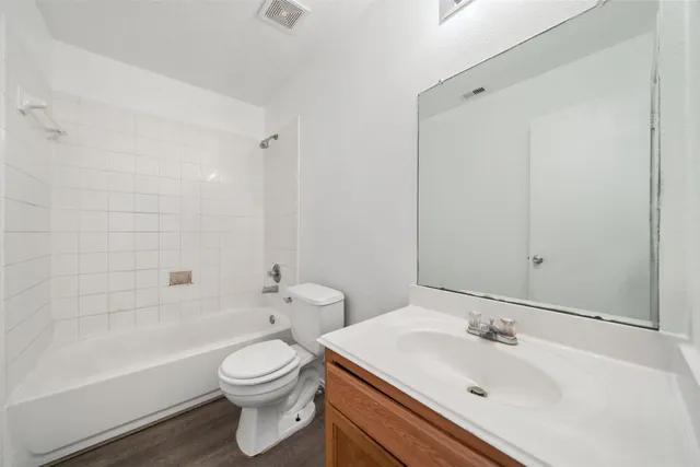 a bathroom with a sink toilet and bathtub