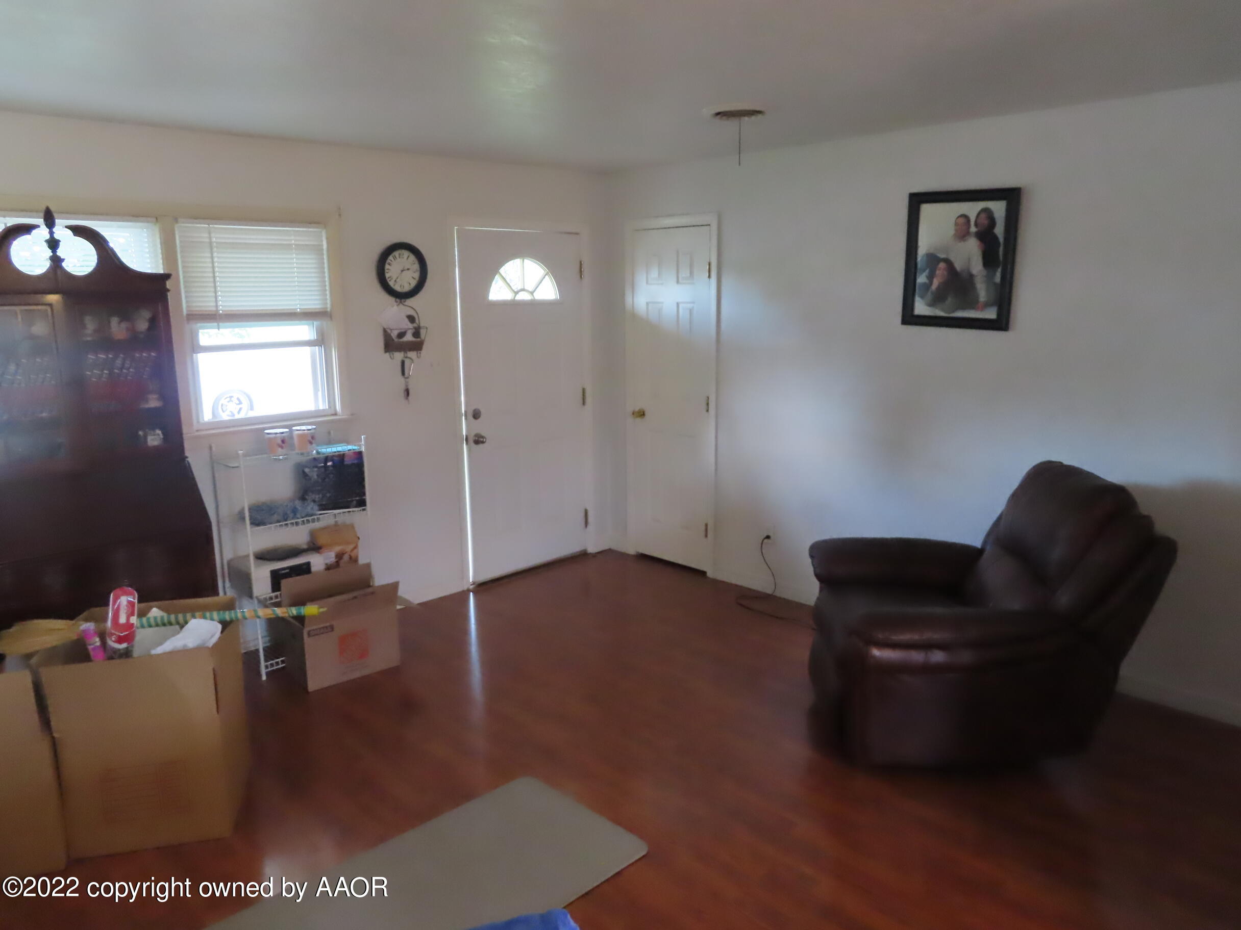 4602 South Rusk Street Amarillo, TX 79110 - Photo 4 of 16 a living room with furniture and a flat screen tv