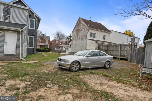 a car parked in front of a house