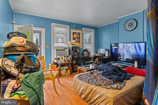 a bed room with furniture and gym equipment