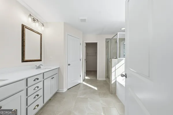 a view of bathroom with dual sinks