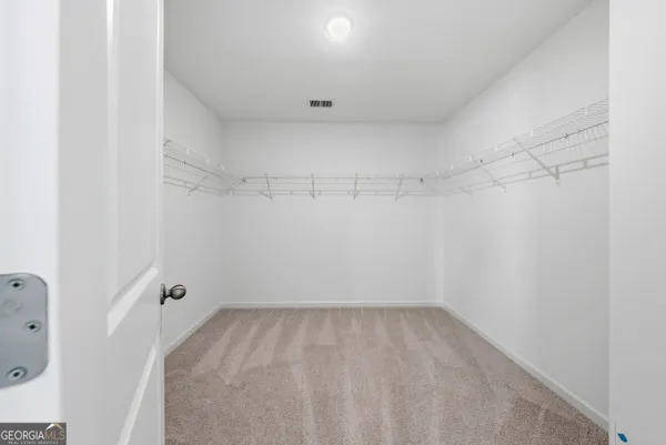 a view of a room with racks on the wall