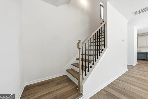 a view of entryway with wooden floor