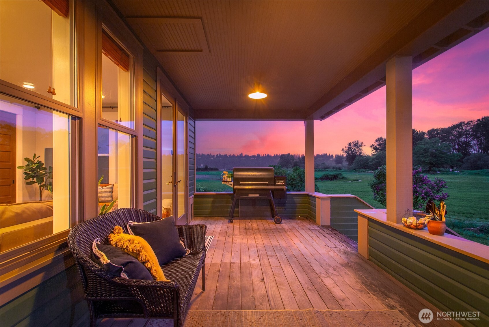 2304 Norman Road Stanwood, WA 98292 - Photo 22 of 39 a outdoor sitting area with furniture and wooden floor