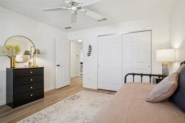 a bedroom with a bed and a dresser