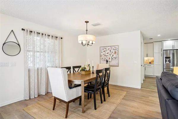 a dining room with furniture and window