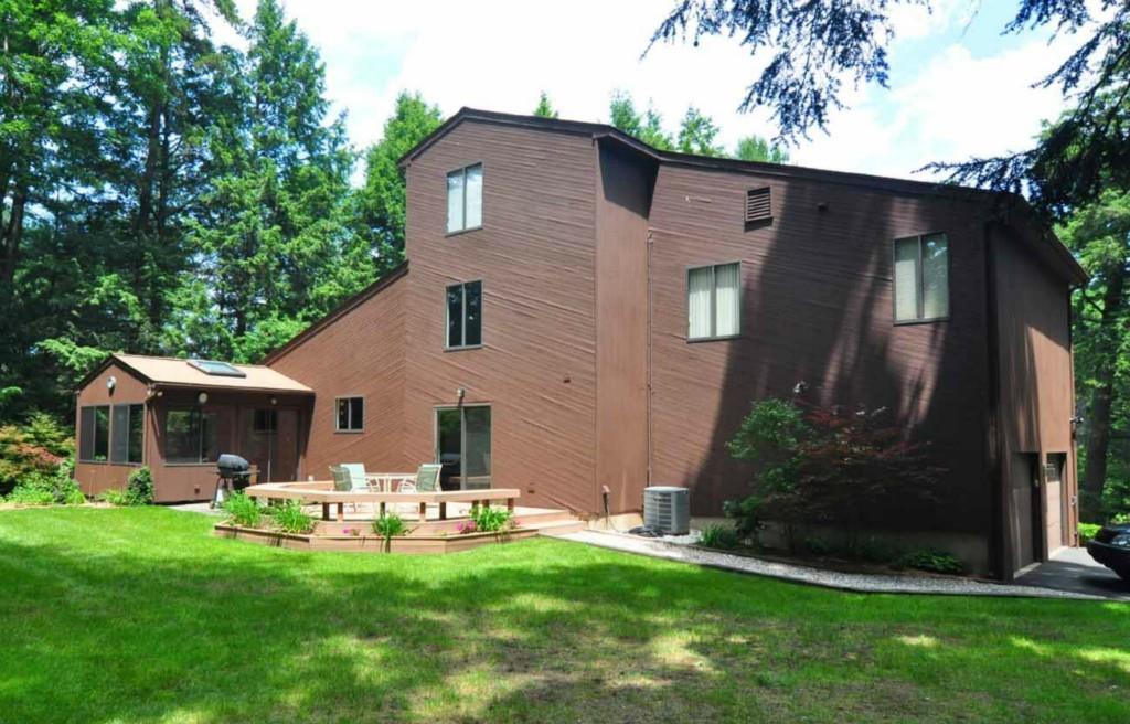 9 High Ridge Drive Granby, CT 06035 - Photo 1 of 1 a front view of a house with patio and garden