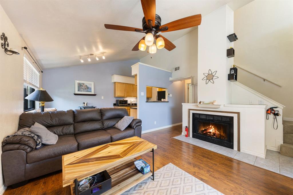 2240 Tarpley Road, Unit 411 Carrollton, TX 75006 - Photo 4 of 28 a living room with furniture and a fireplace