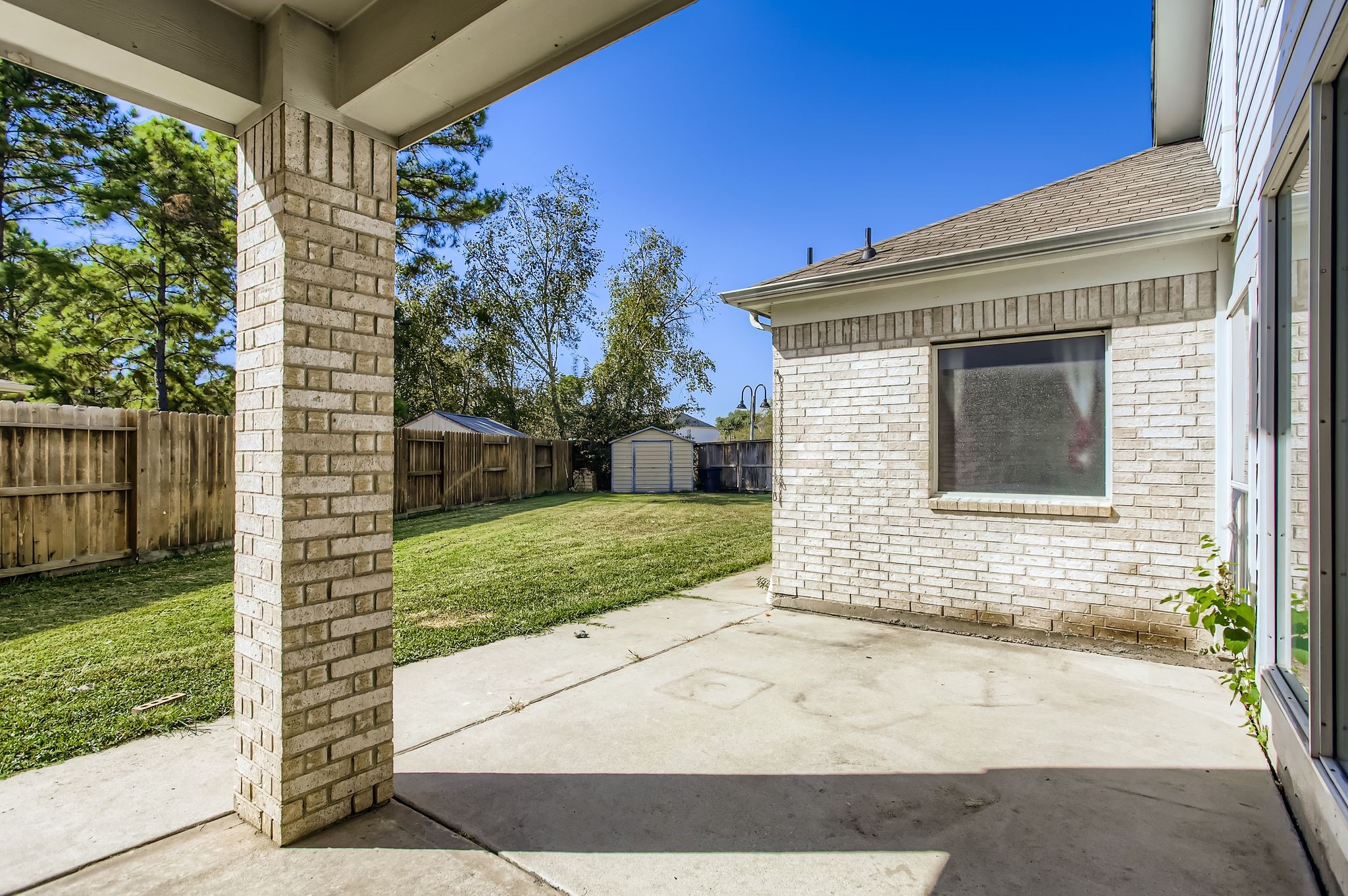 727 Pine Thicket Court Spring, TX 77373 - Photo 26 of 29 a side view of a house with a yard
