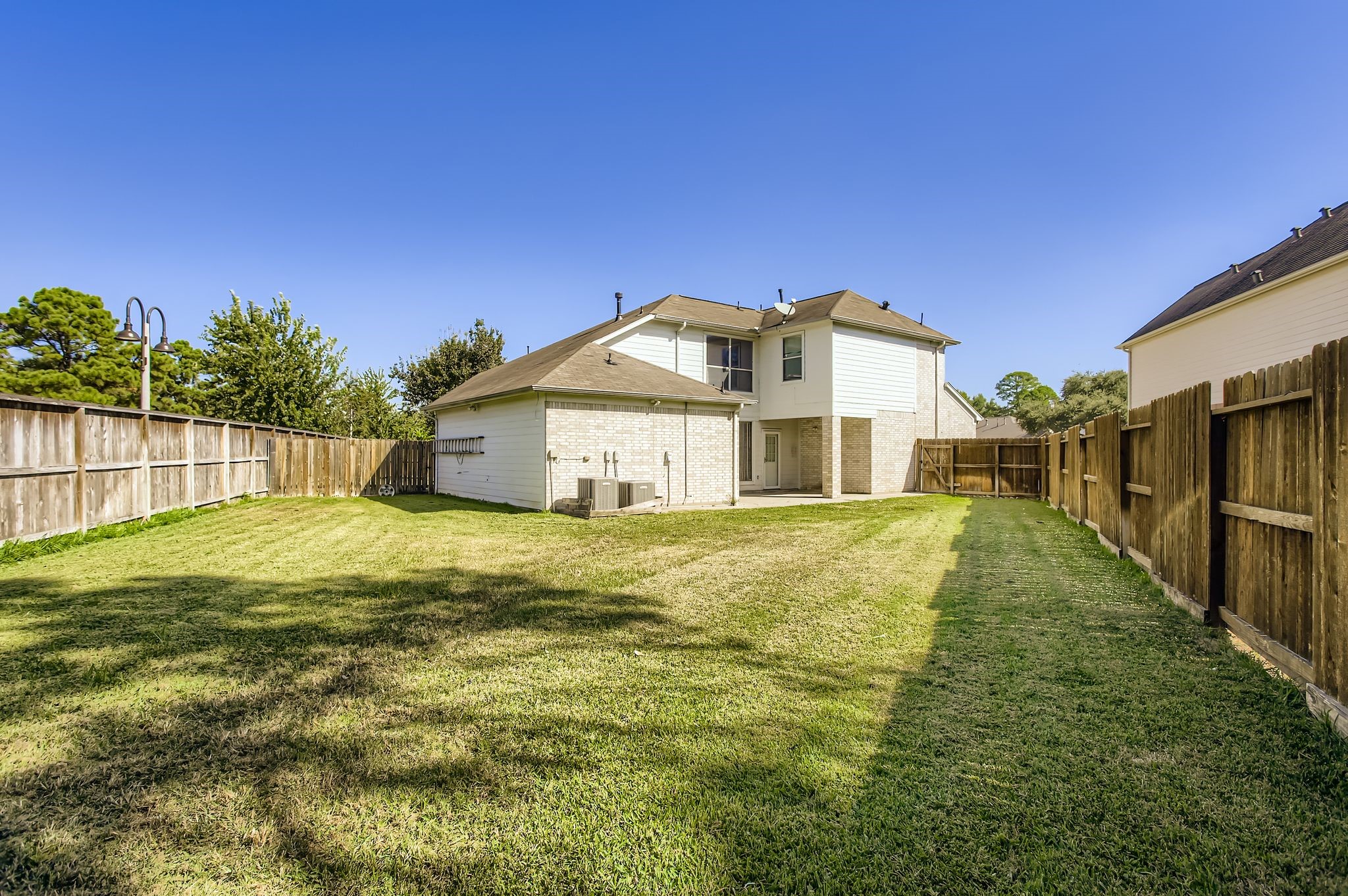 727 Pine Thicket Court Spring, TX 77373 - Photo 27 of 29 a front view of a house with a yard