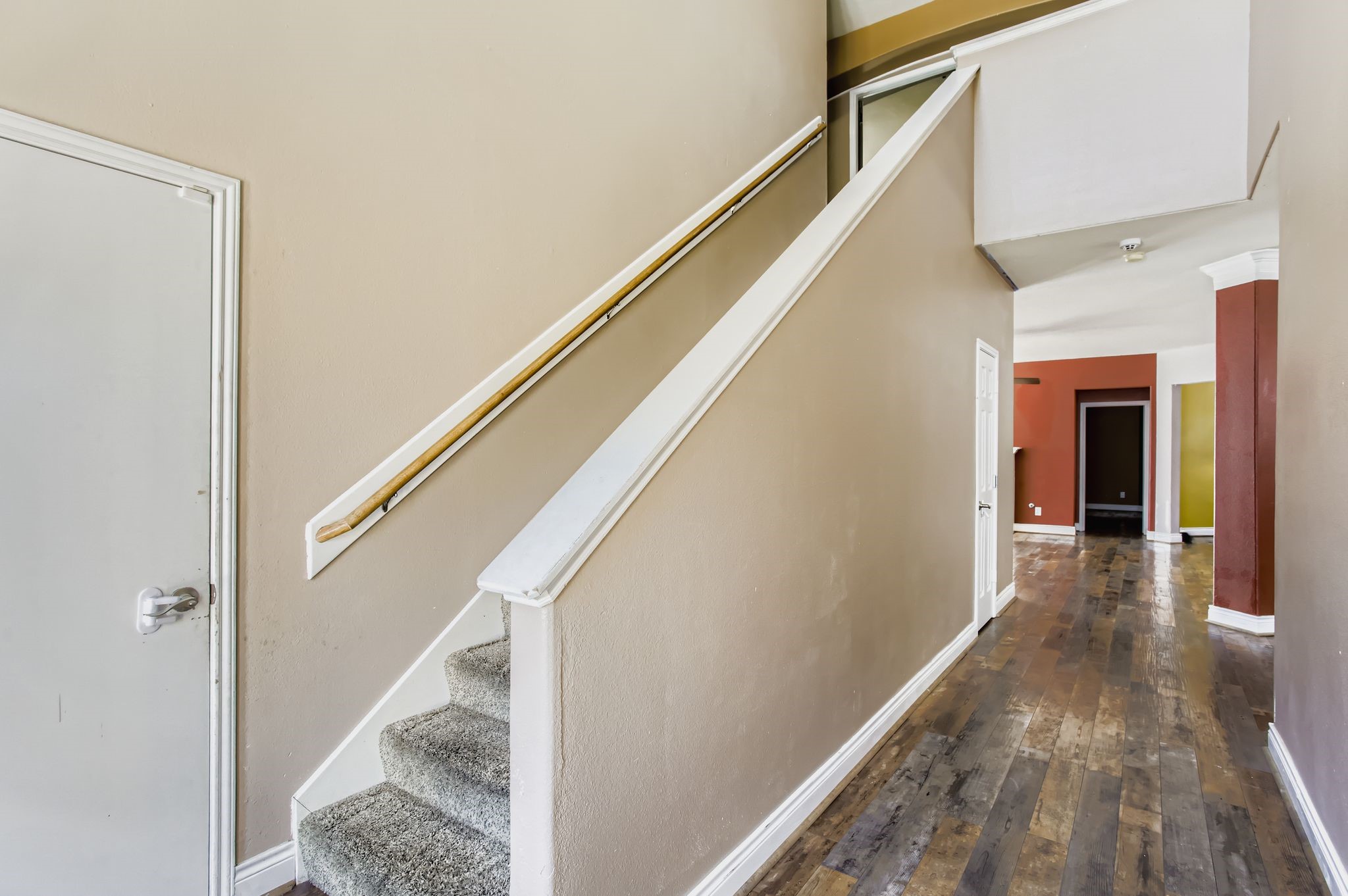 727 Pine Thicket Court Spring, TX 77373 - Photo 5 of 29 a view of a hallway with wooden floor and staircase