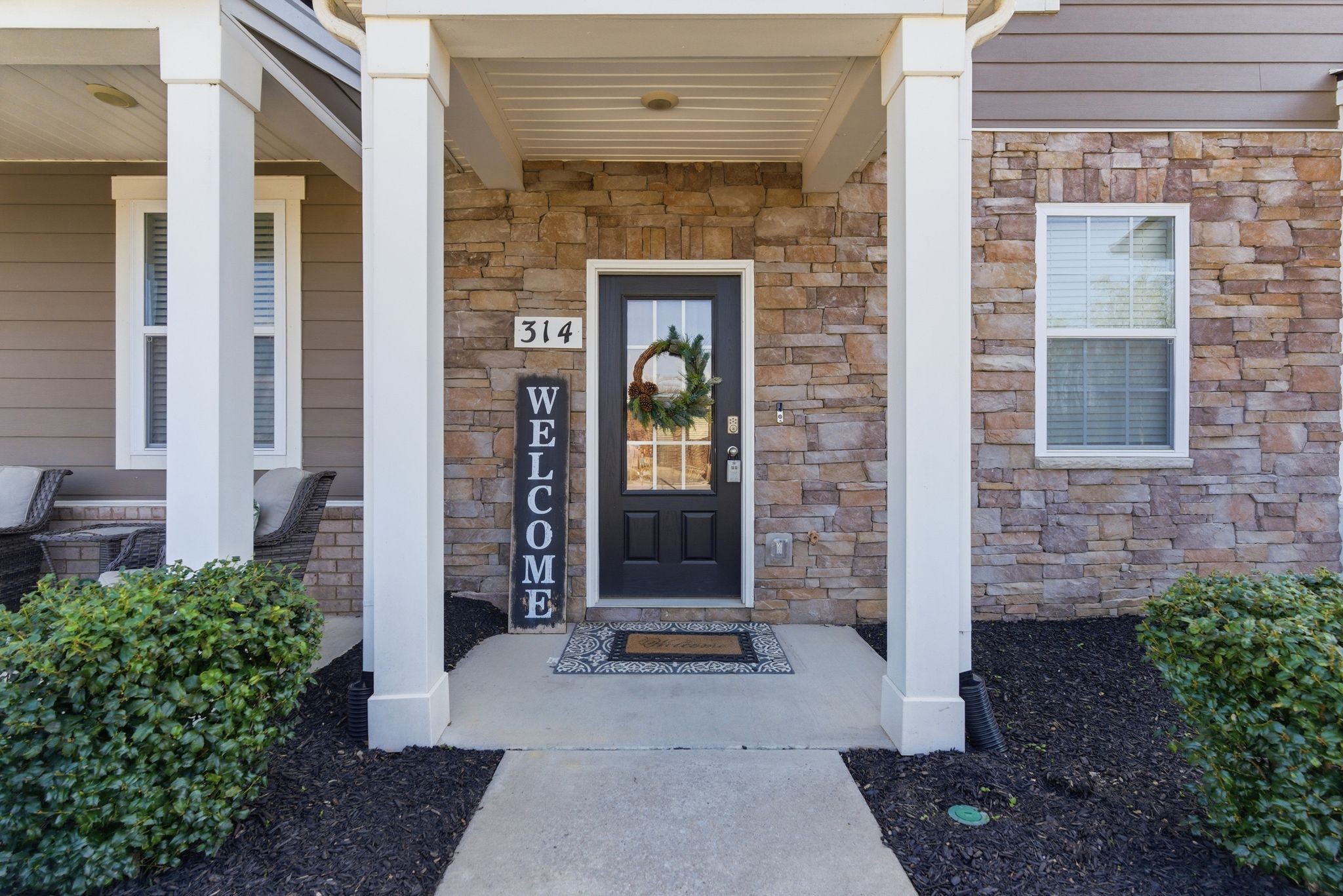 314 Carr Lane Lebanon, TN 37087 - Photo 2 of 14 a front view of a house with a garden