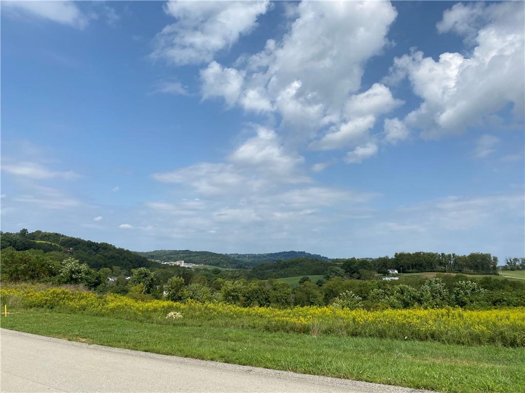 150 Sharon Drive Pleasant Unity, PA 15676 - Photo 9 of 16 a view of a city with mountains in the background