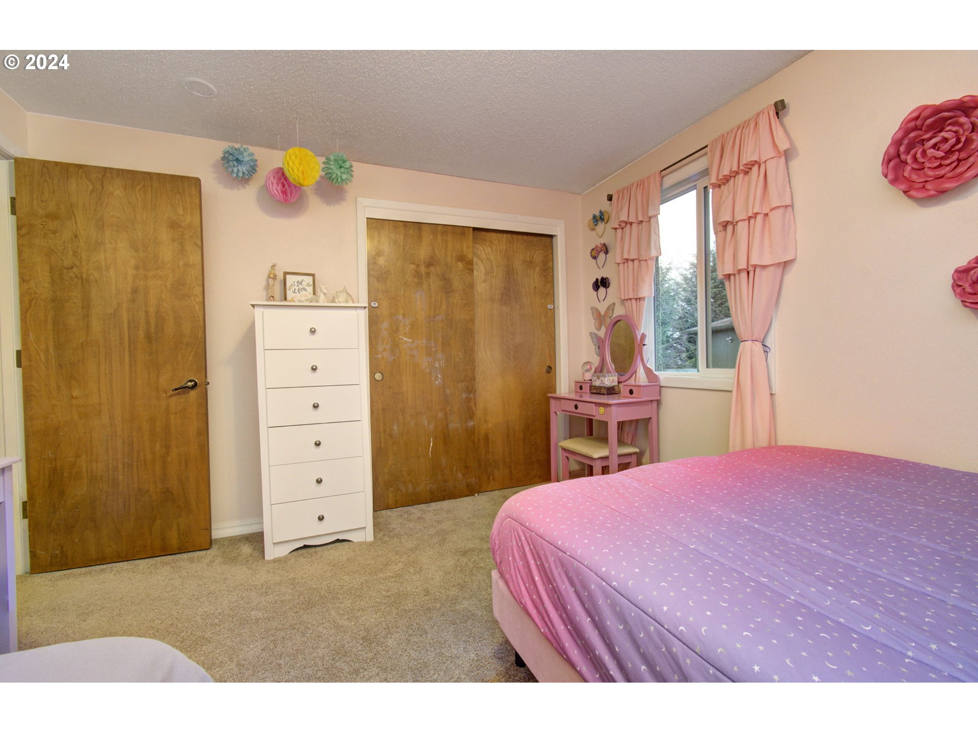 304 Northwest 8th Street Battle Ground, WA 98604 - Photo 21 of 35 a bedroom with a bed dresser and a window