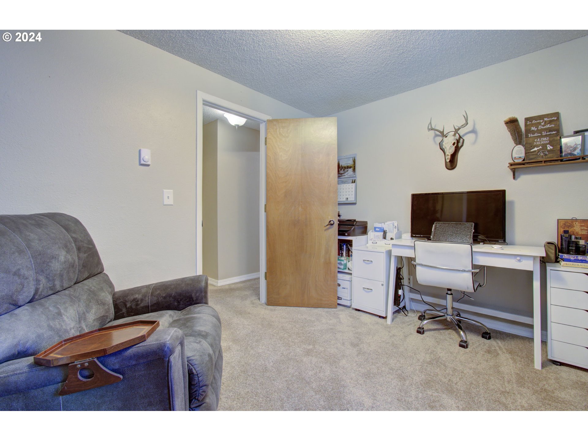 304 Northwest 8th Street Battle Ground, WA 98604 - Photo 24 of 35 a living room with furniture and a flat screen tv