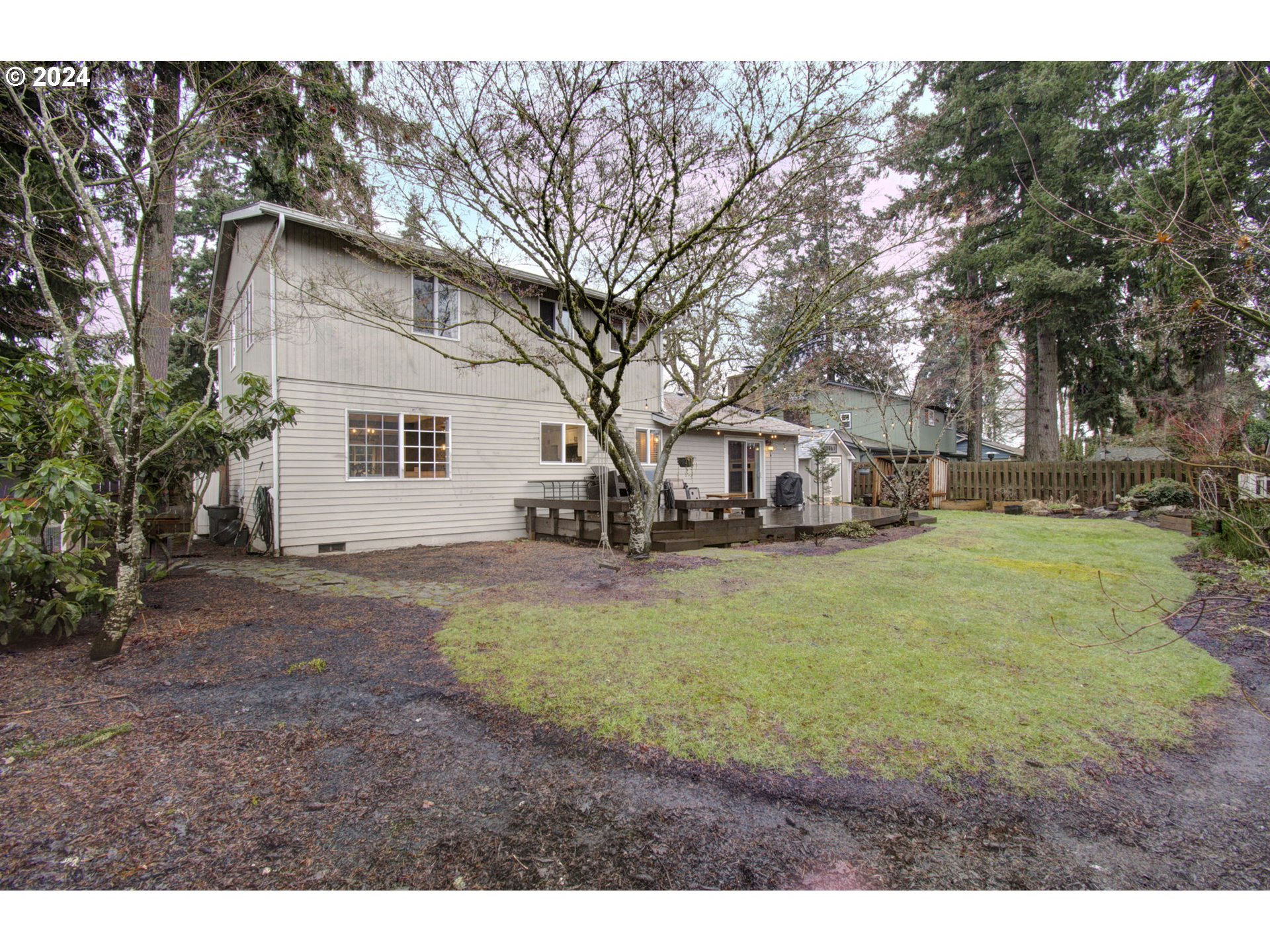 304 Northwest 8th Street Battle Ground, WA 98604 - Photo 30 of 35 a view of a yard with a house and a large tree
