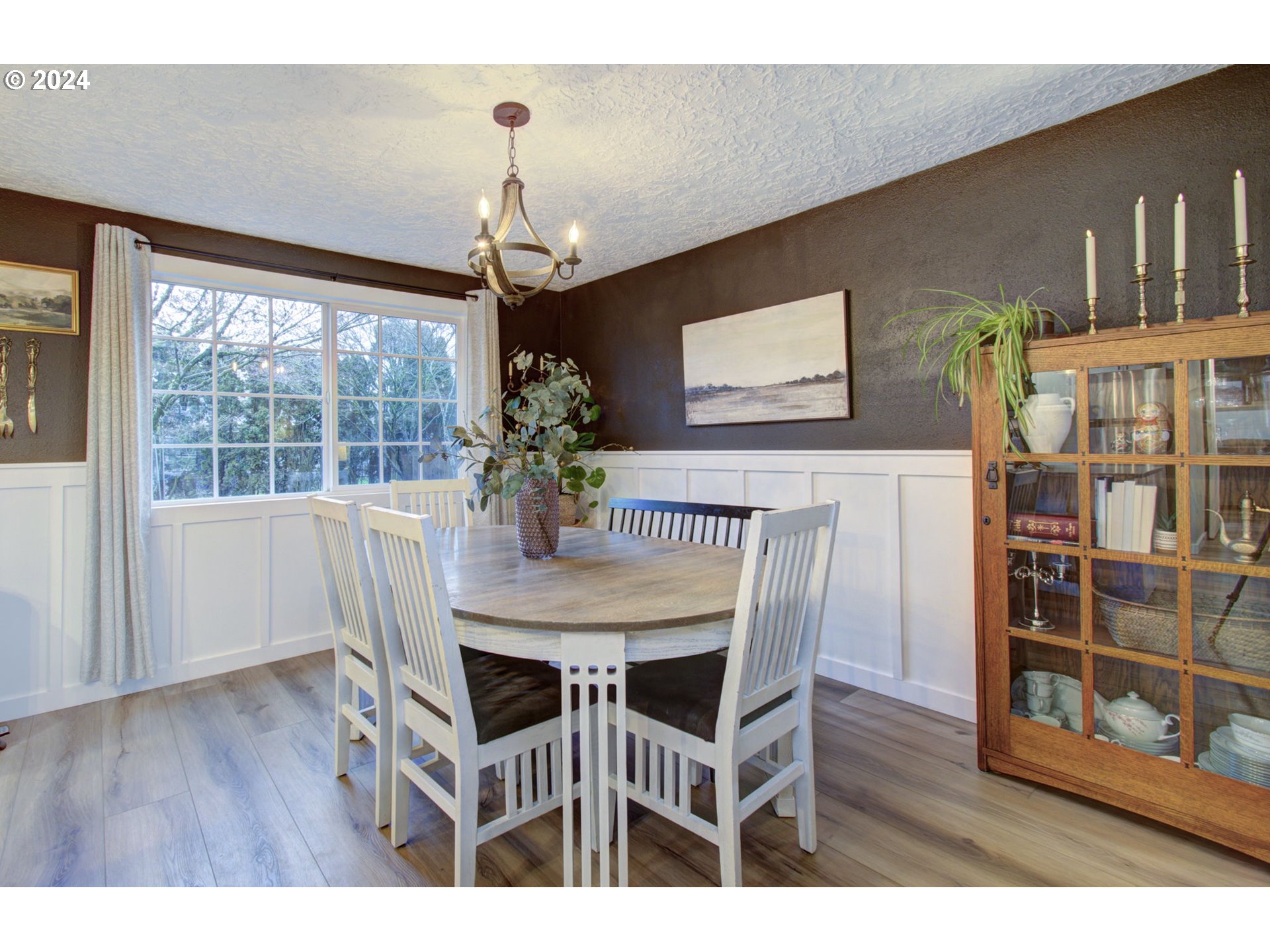 304 Northwest 8th Street Battle Ground, WA 98604 - Photo 6 of 35 a dining room with furniture window and wooden floor