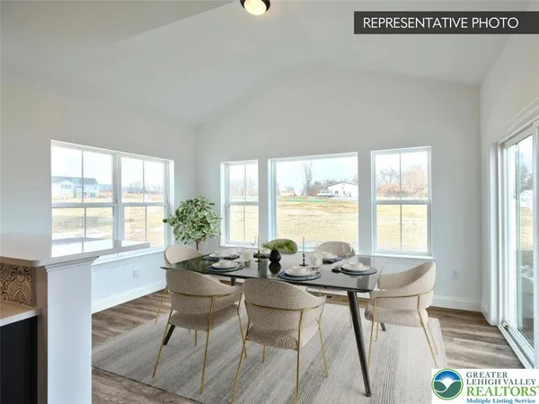 a dining room with furniture and windows