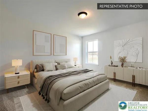 a bedroom with a bed and a couch
