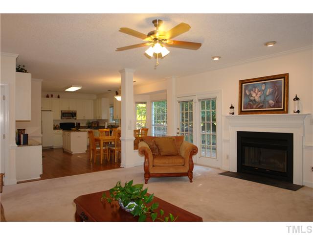 11612 Shavenrock Place Raleigh, NC 27613 - Photo 11 of 25 a living room with furniture and a fireplace