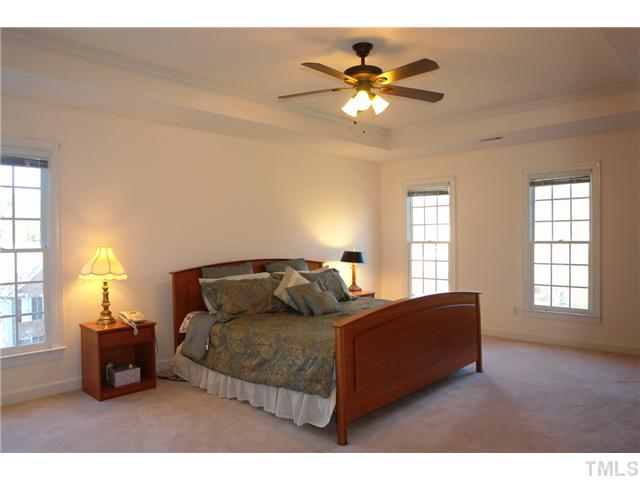 11612 Shavenrock Place Raleigh, NC 27613 - Photo 13 of 25 a bedroom with a bed and window