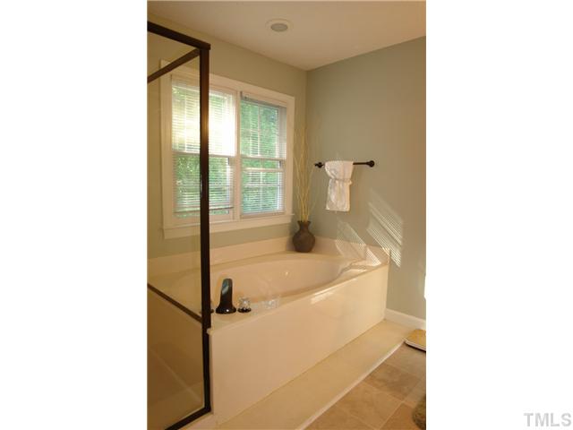 11612 Shavenrock Place Raleigh, NC 27613 - Photo 17 of 25 a en suite bathroom with a sink and a shower