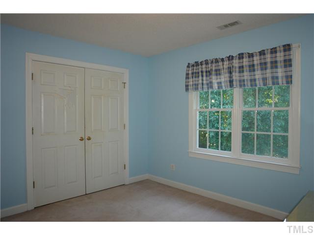11612 Shavenrock Place Raleigh, NC 27613 - Photo 19 of 25 a view of an empty room with a window