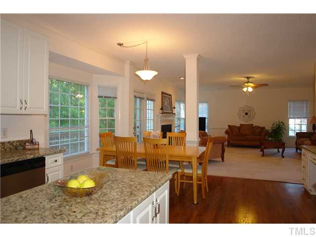 11612 Shavenrock Place Raleigh, NC 27613 - Photo 10 of 25 a living room with furniture kitchen view and a large window