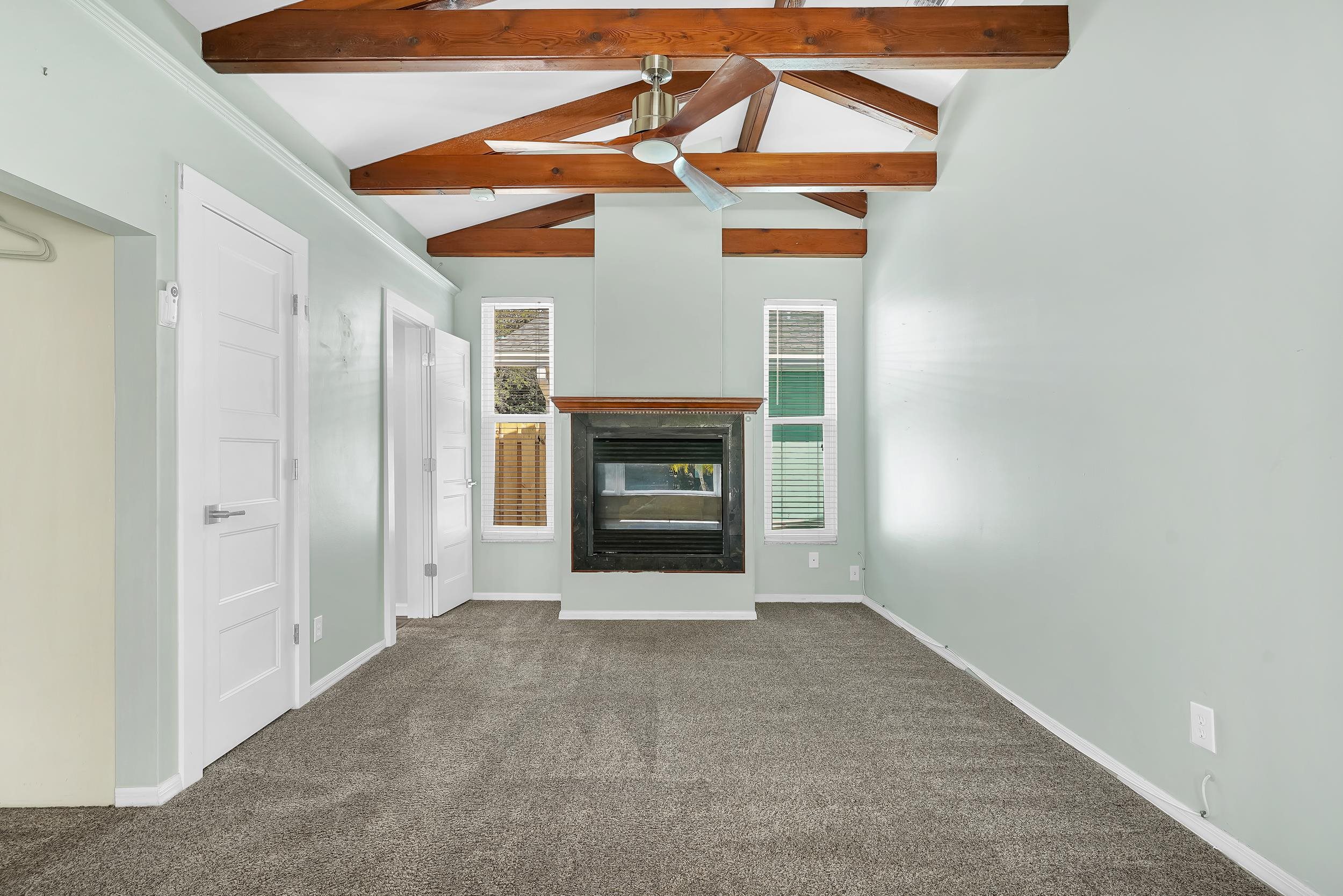 401 E Street St. Augustine, FL 32080 - Photo 12 of 36 a view of an empty room with a fireplace and a window