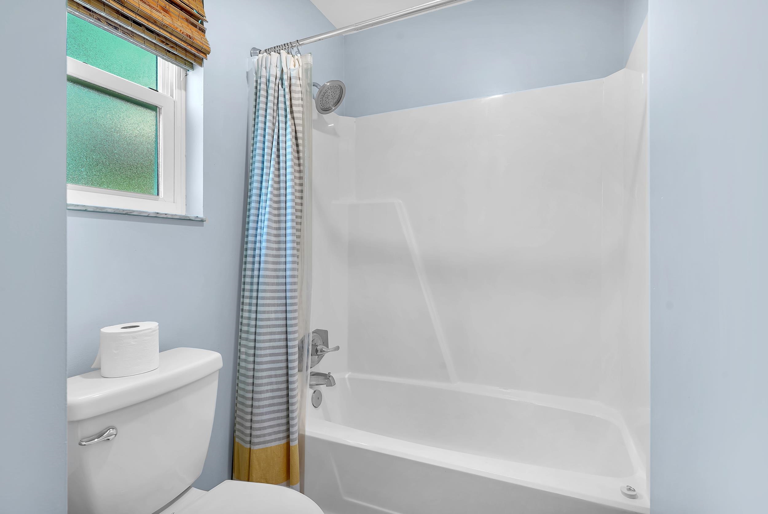 401 E Street St. Augustine, FL 32080 - Photo 18 of 36 a bathroom with a toilet and shower