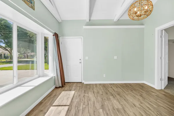 a view of an empty room with a window