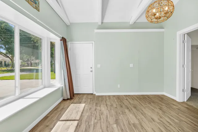 a view of an empty room with a window