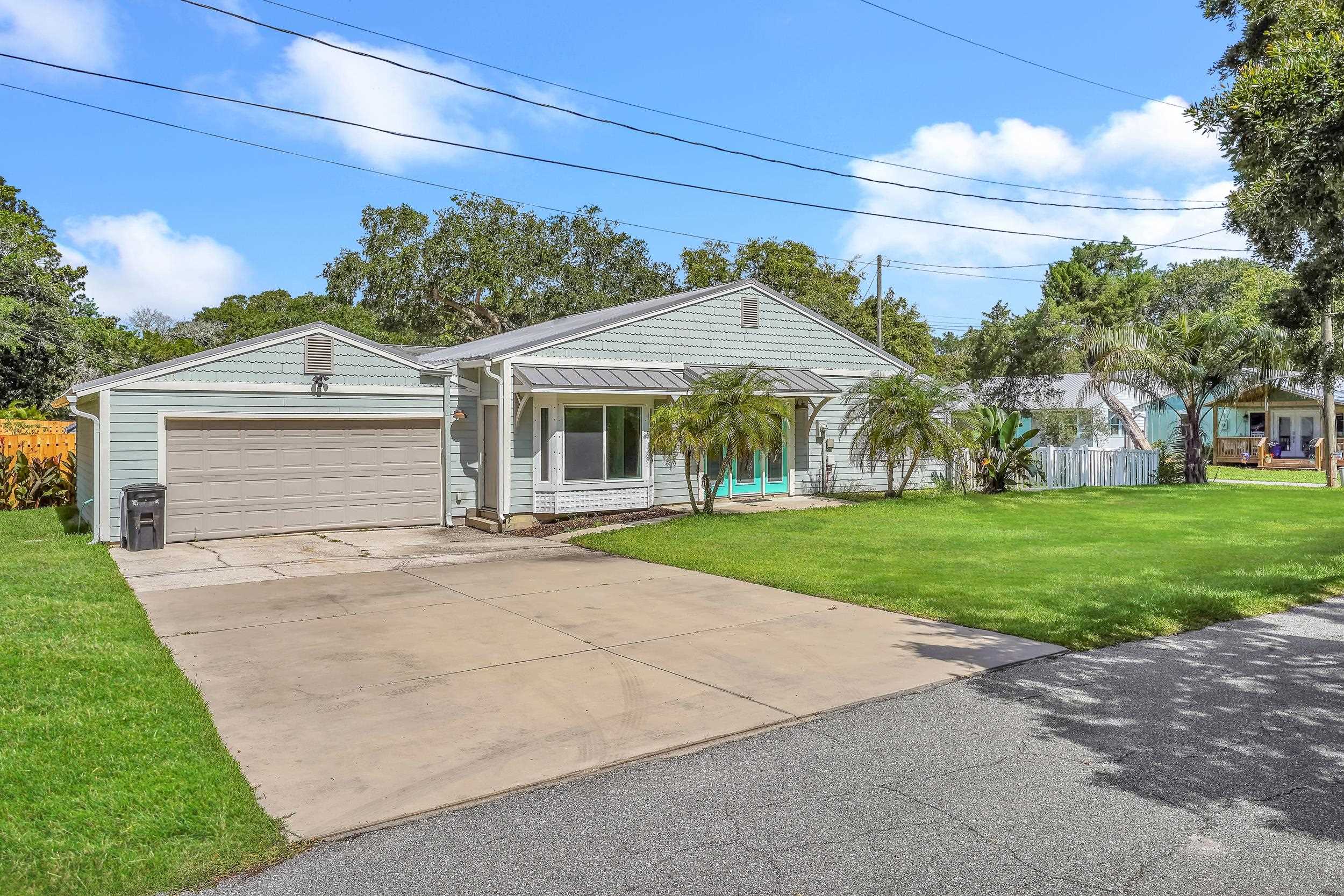 401 E Street St. Augustine, FL 32080 - Photo 3 of 36 a front view of house with yard and green space