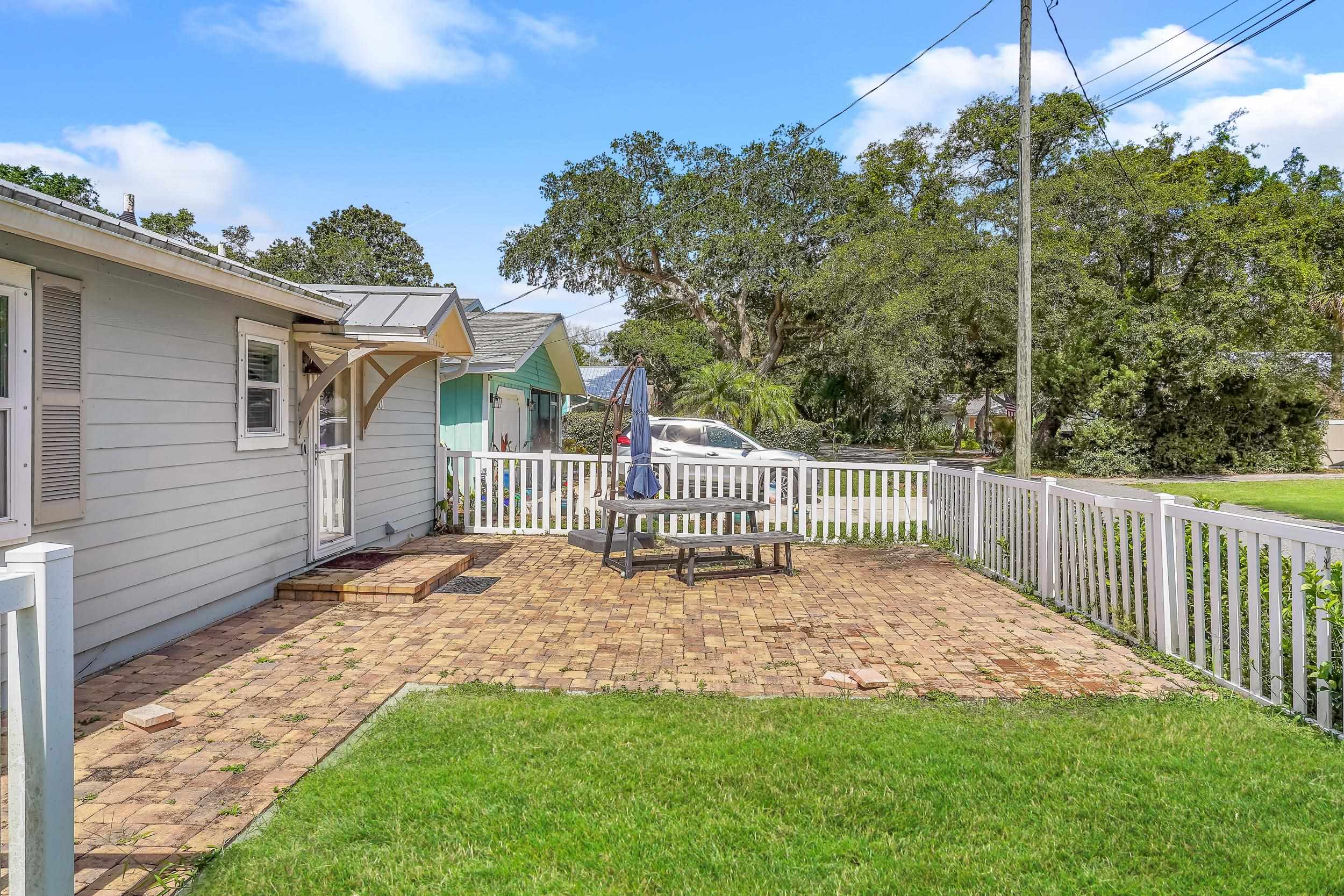 401 E Street St. Augustine, FL 32080 - Photo 32 of 36 a view of a house with a yard and potted plants
