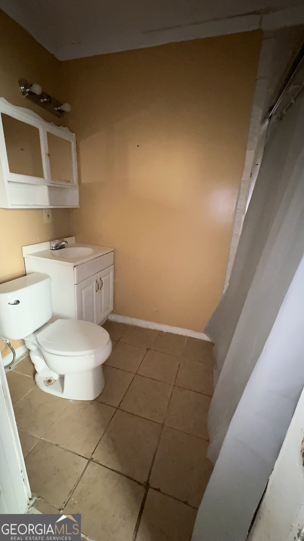 544 Conley Road Forest Park, GA 30297 - Photo 12 of 17 a bathroom with a toilet and a sink