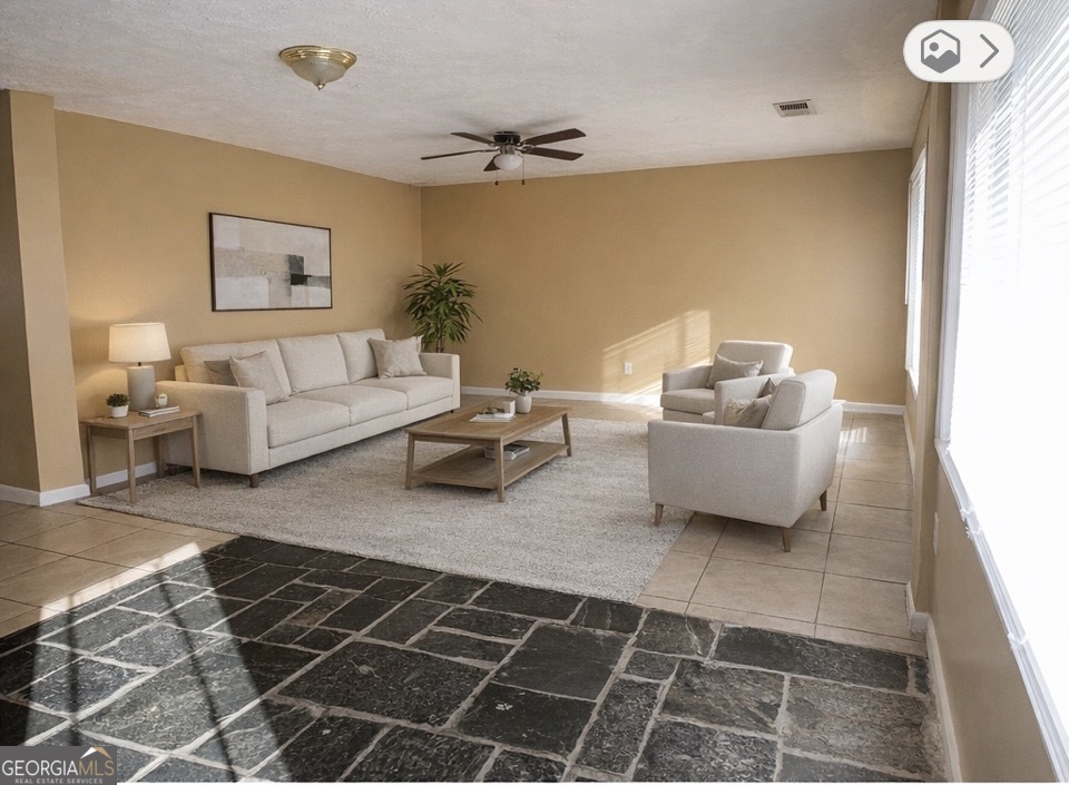 544 Conley Road Forest Park, GA 30297 - Photo 3 of 17 a living room with furniture and a rug