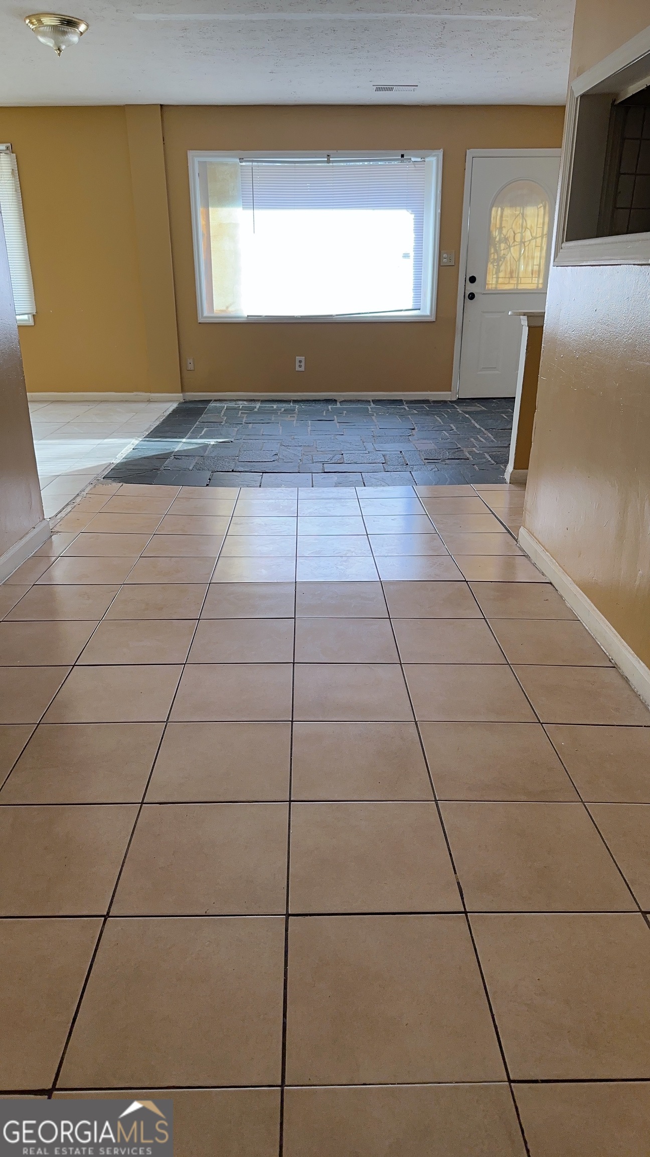 544 Conley Road Forest Park, GA 30297 - Photo 6 of 17 a view of a livingroom with an empty space and window